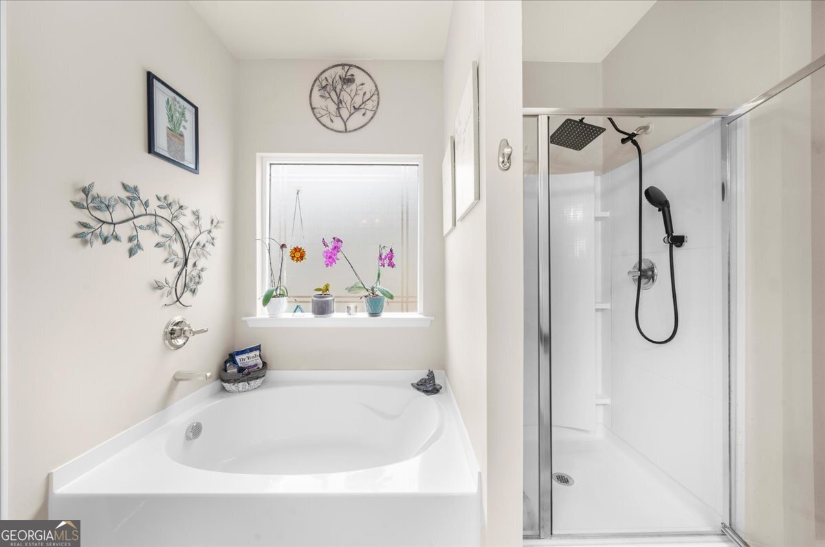 15 Gala Drive Northeast Rome, GA 30165 - Photo 39 of 60 a bathroom with a bathtub and shower