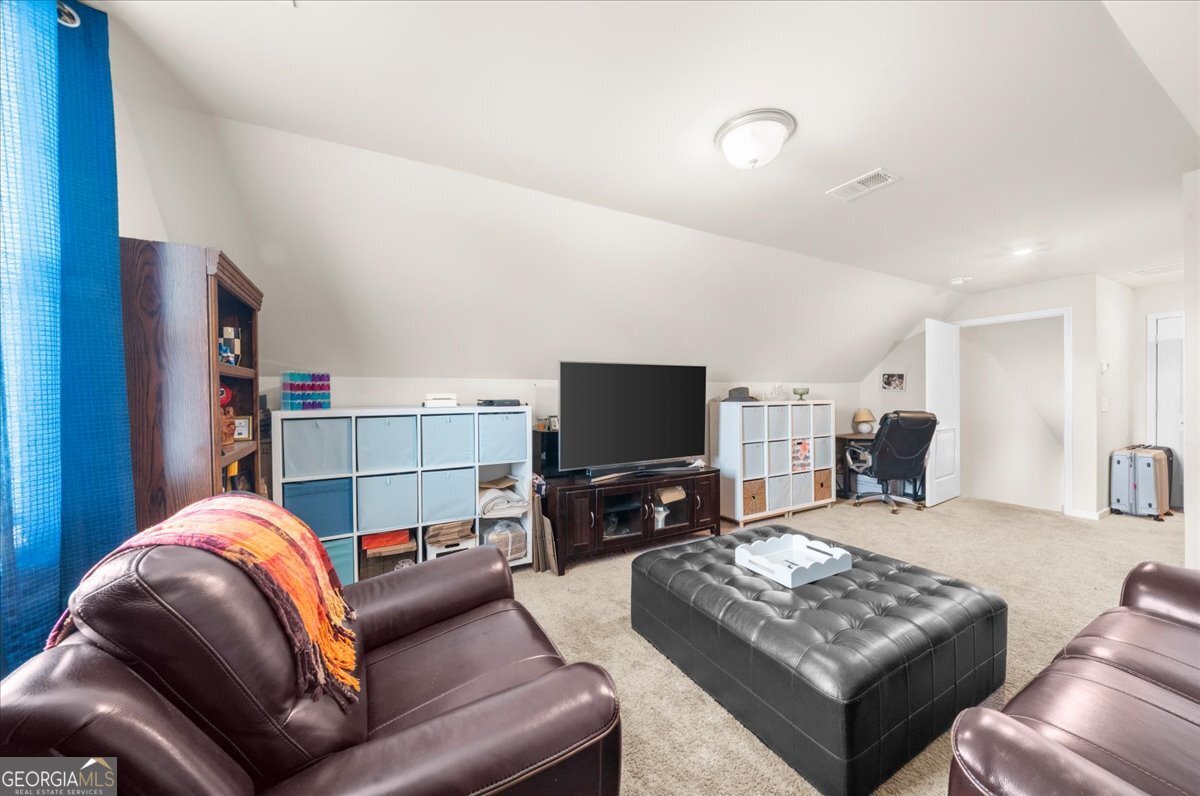 15 Gala Drive Northeast Rome, GA 30165 - Photo 43 of 60 a living room with furniture and a flat screen tv