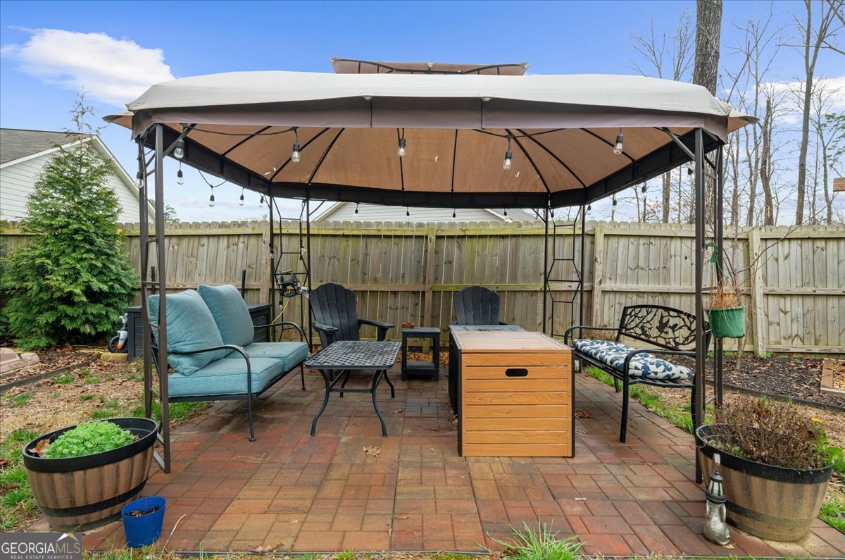 15 Gala Drive Northeast Rome, GA 30165 - Photo 46 of 60 a patio with a patio table and chairs