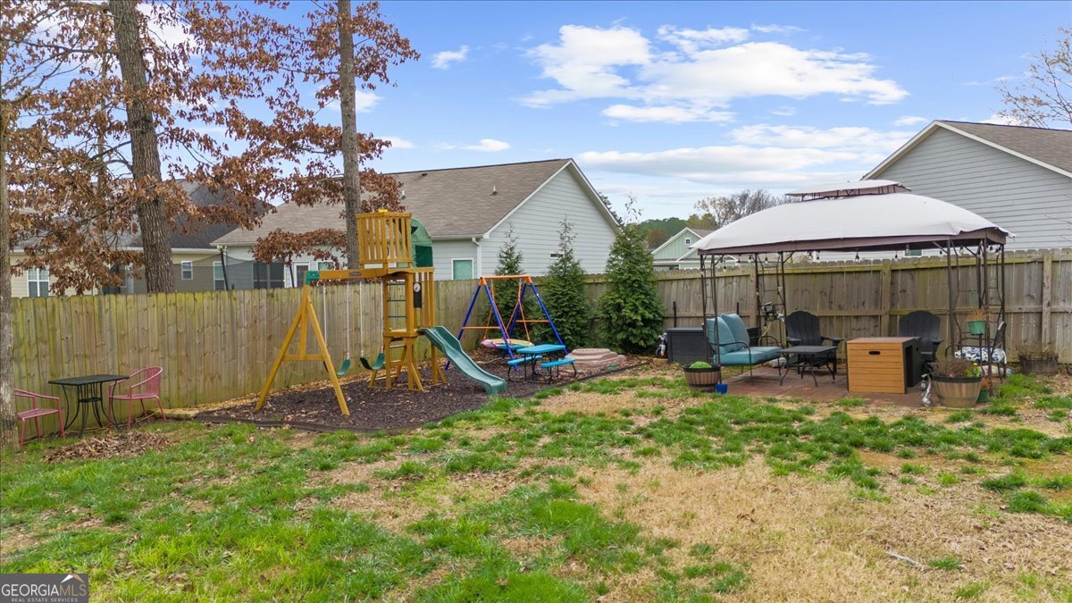 15 Gala Drive Northeast Rome, GA 30165 - Photo 56 of 60 a view of a house with a backyard and sitting area