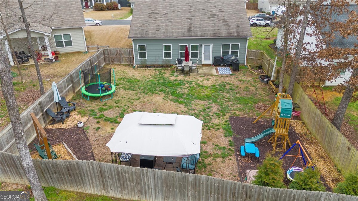 15 Gala Drive Northeast Rome, GA 30165 - Photo 58 of 60 front view of house with a chairs and table in the patio