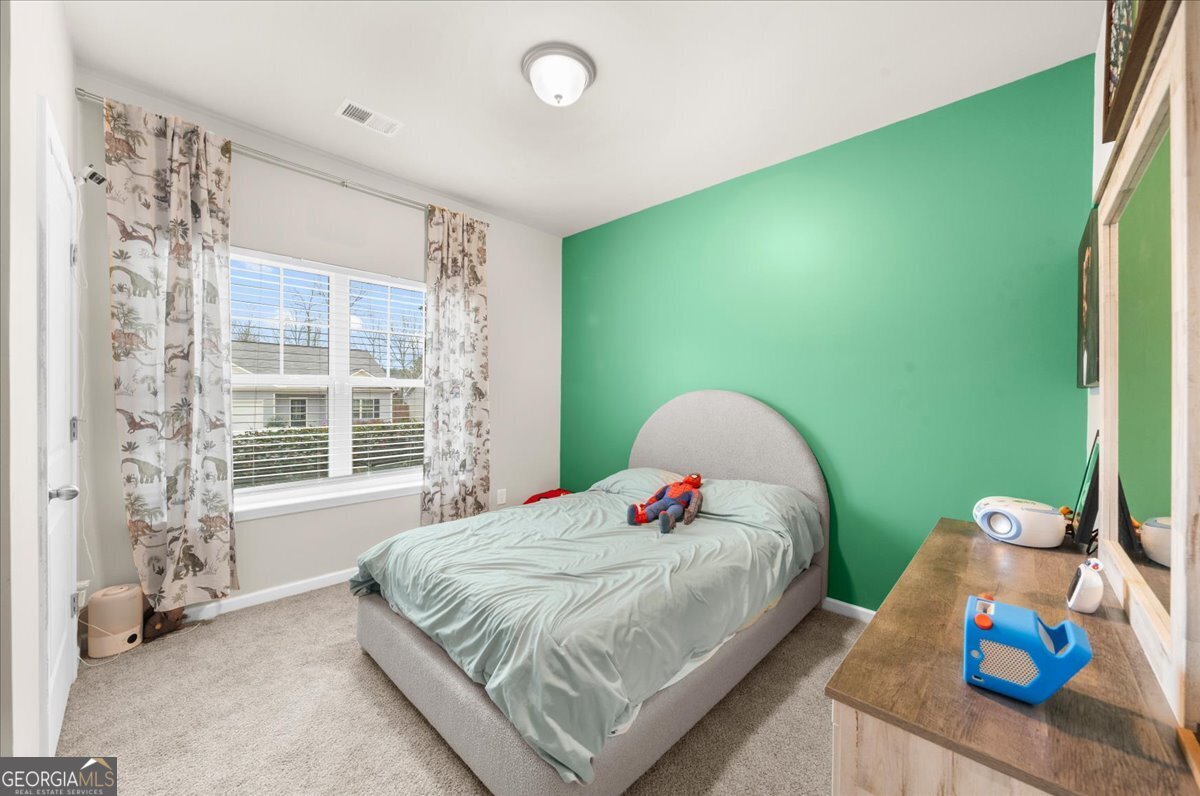 15 Gala Drive Northeast Rome, GA 30165 - Photo 8 of 60 a bedroom with a bed and a window