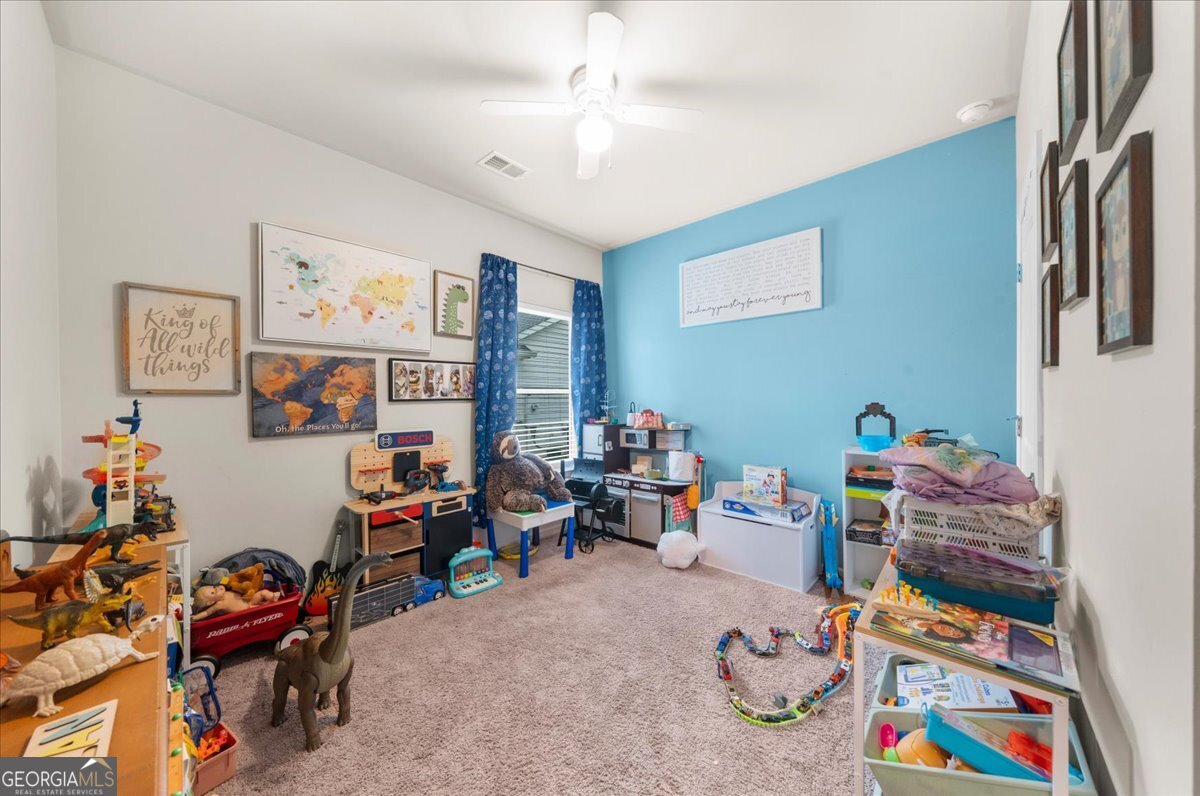 15 Gala Drive Northeast Rome, GA 30165 - Photo 10 of 60 a bedroom with furniture and a book shelf