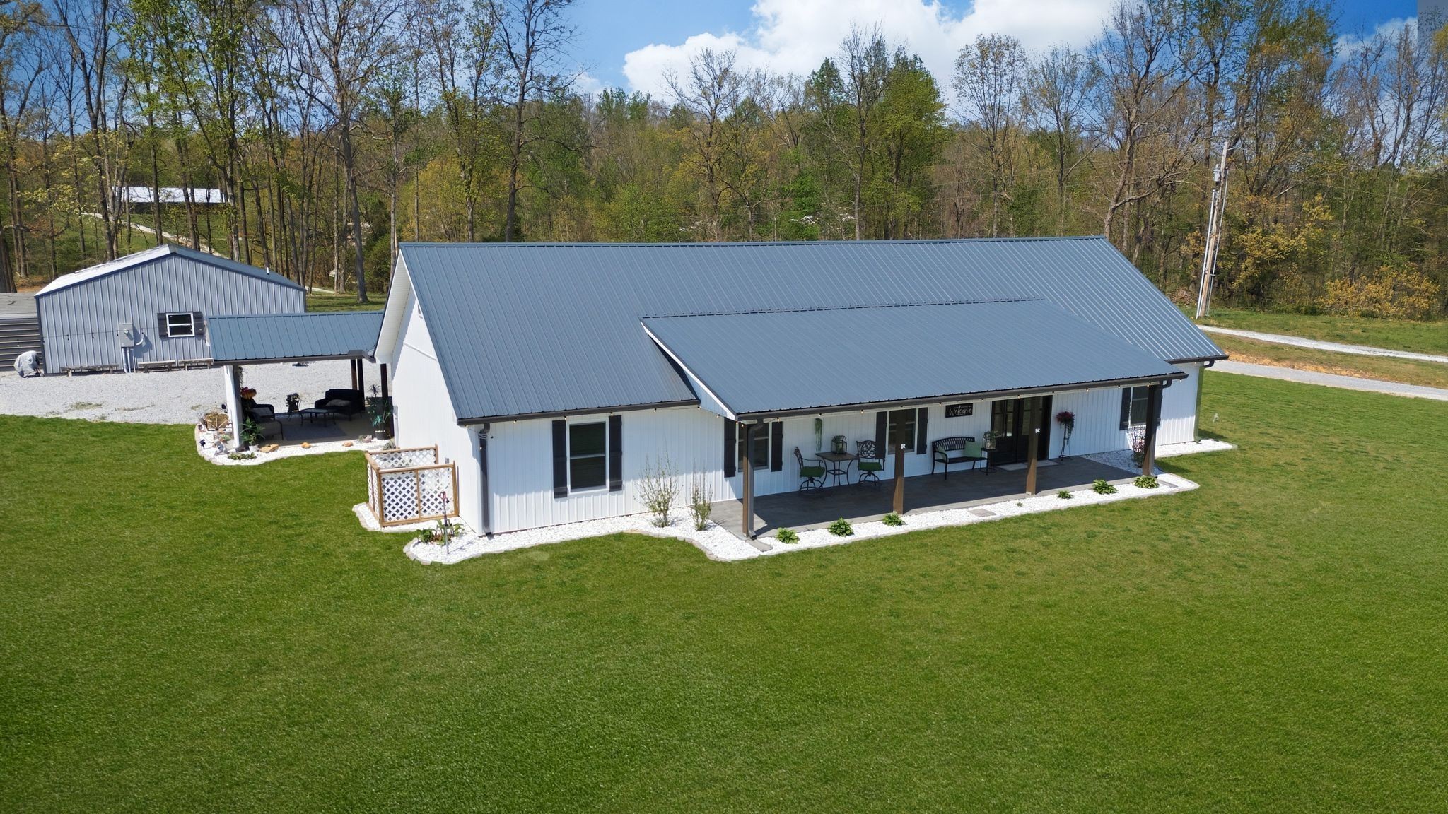 1043 Murphy Hollow Road Vanleer, TN 37181 - Photo 5 of 68 a view of a house with a yard and sitting area