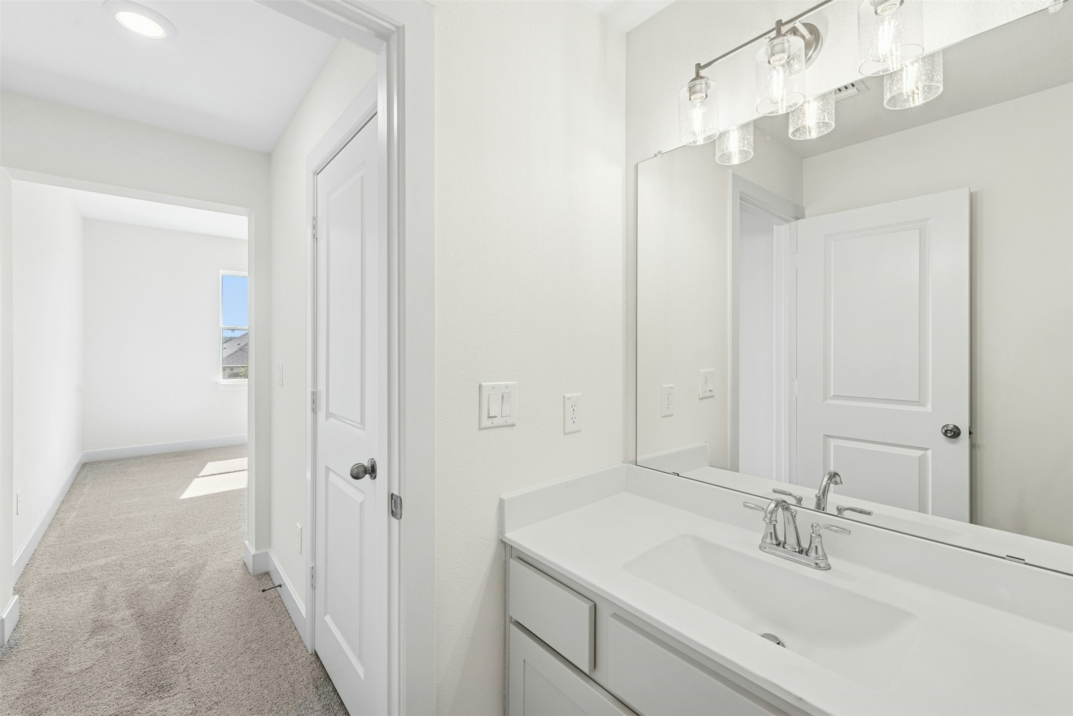 1520 Rodeo Ridge Drive Georgetown, TX 78628 - Photo 19 of 29 Bathroom featuring vanity and light colored carpet