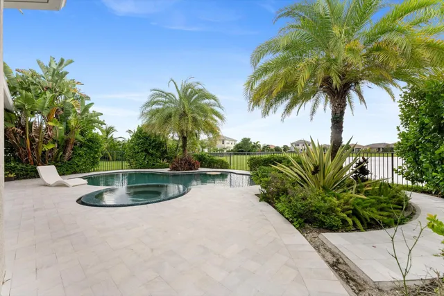 a view of a lake with houses in the back