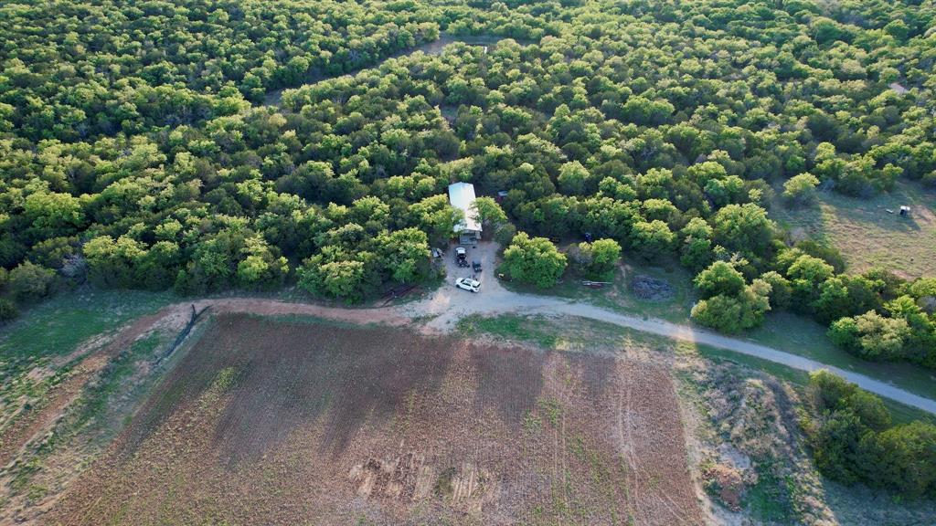 16811 County Road 107 Mingus, TX 76463 - Photo 3 of 38 a view of a large yard with lots of green space