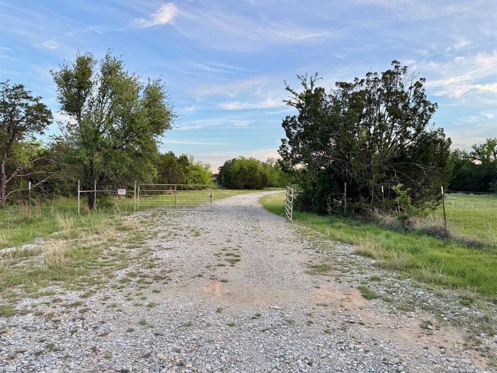 16811 County Road 107 Mingus, TX 76463 - Photo 34 of 38 a backyard of a house with lots of green space