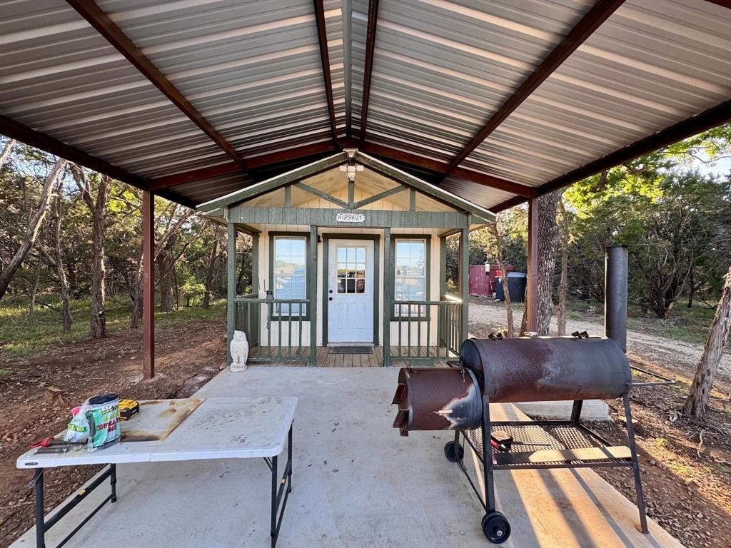 16811 County Road 107 Mingus, TX 76463 - Photo 10 of 38 a patio with yard table and chairs
