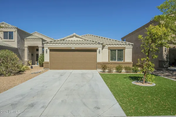 a front view of a house with a yard