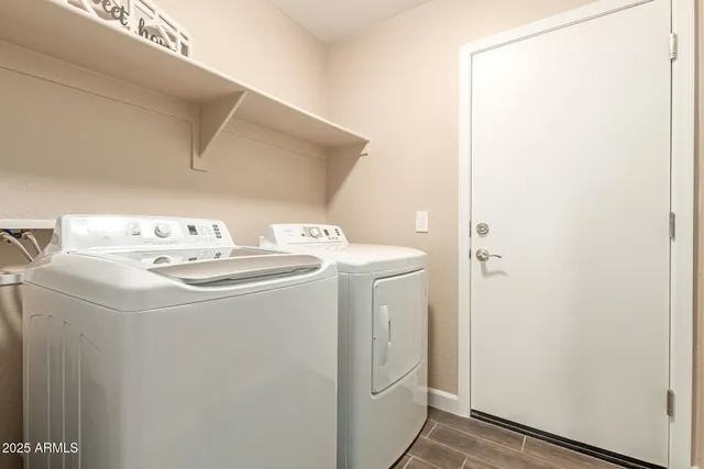 a view of an empty room with a ceiling fan