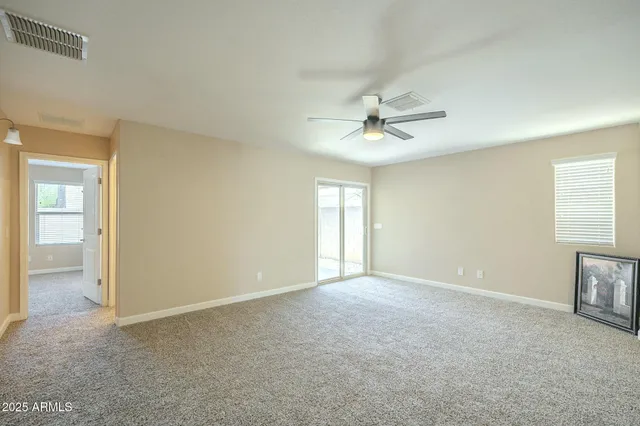 a kitchen with a refrigerator and a stove top oven