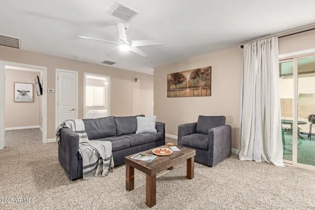 a living room with furniture and a large window
