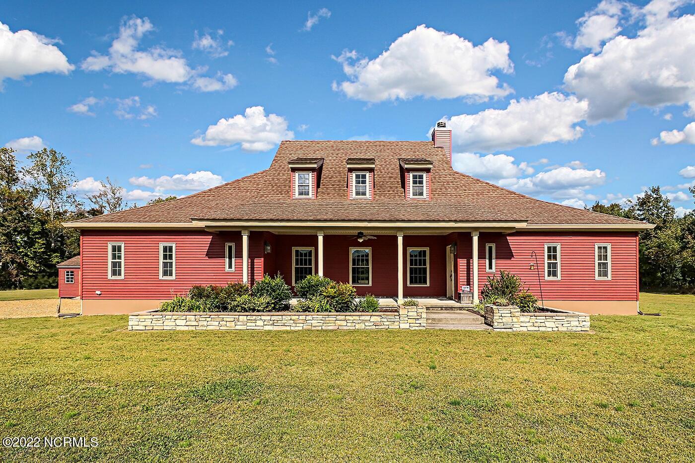 Welcome to 1079 Tulls Creek Road, nestled on 10 acres in Currituck County.