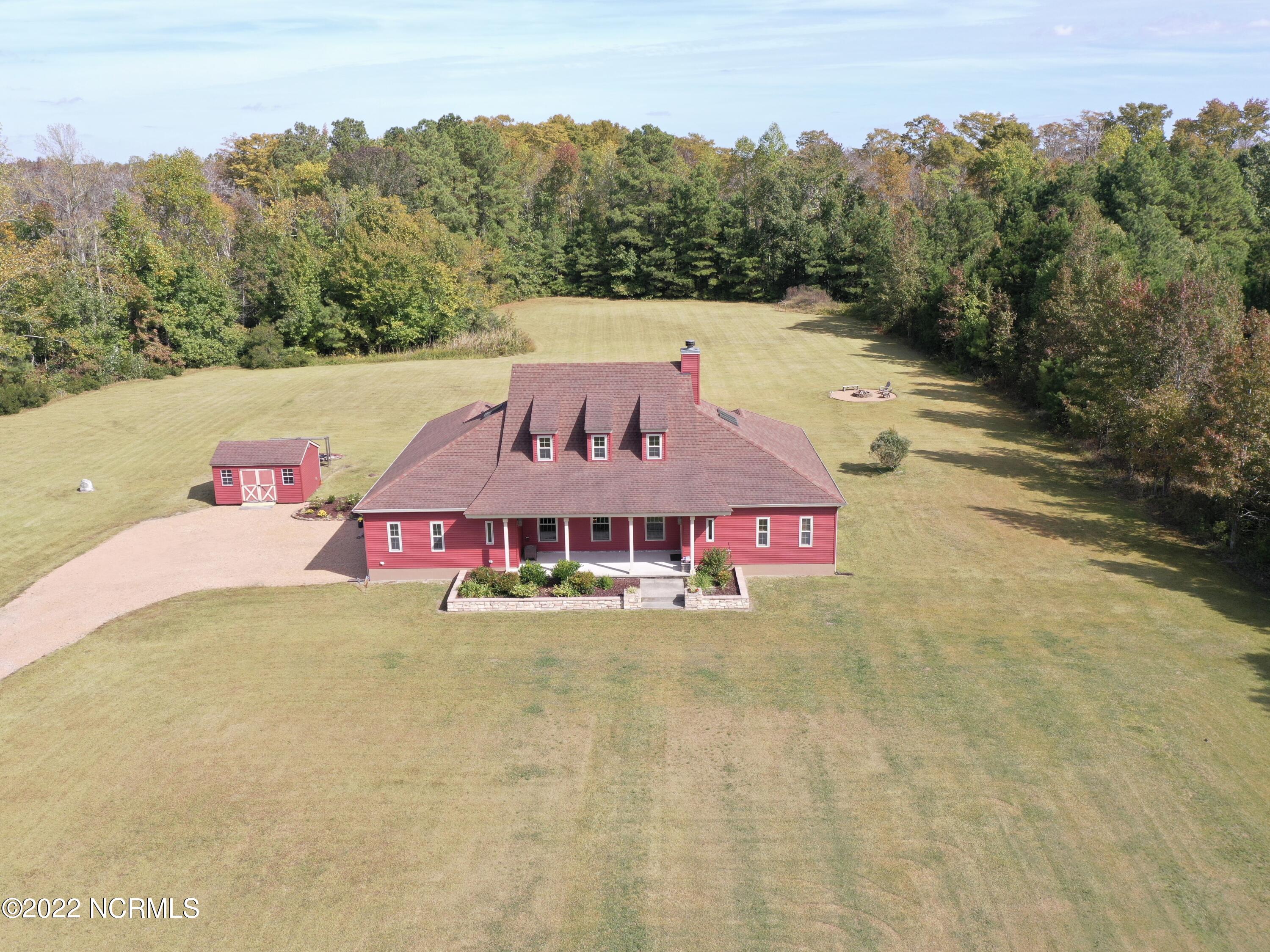1079 Tulls Creek Road Moyock, NC 27958 - Photo 2 of 59 One of a kind, gracious southern style transitional 2 story home with its sprawling front porch and over 3100 sqft is nestled on 10 acres in Currituck County. Classic and exceptional details in this well maintained and lovingly cared for Home.