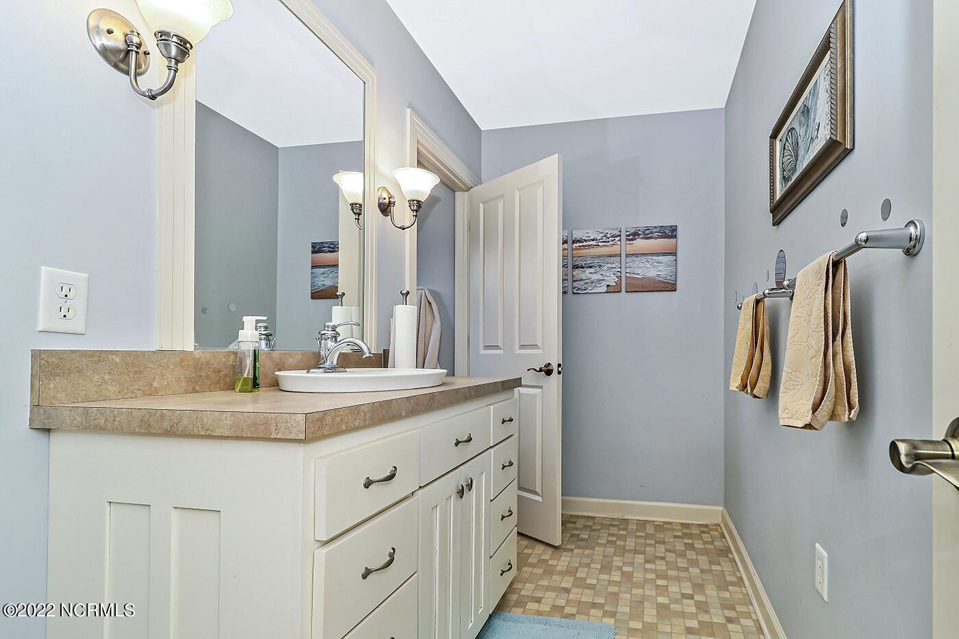 1079 Tulls Creek Road Moyock, NC 27958 - Photo 40 of 59 Full Bathroom on the first floor serves the secondary bedrooms.