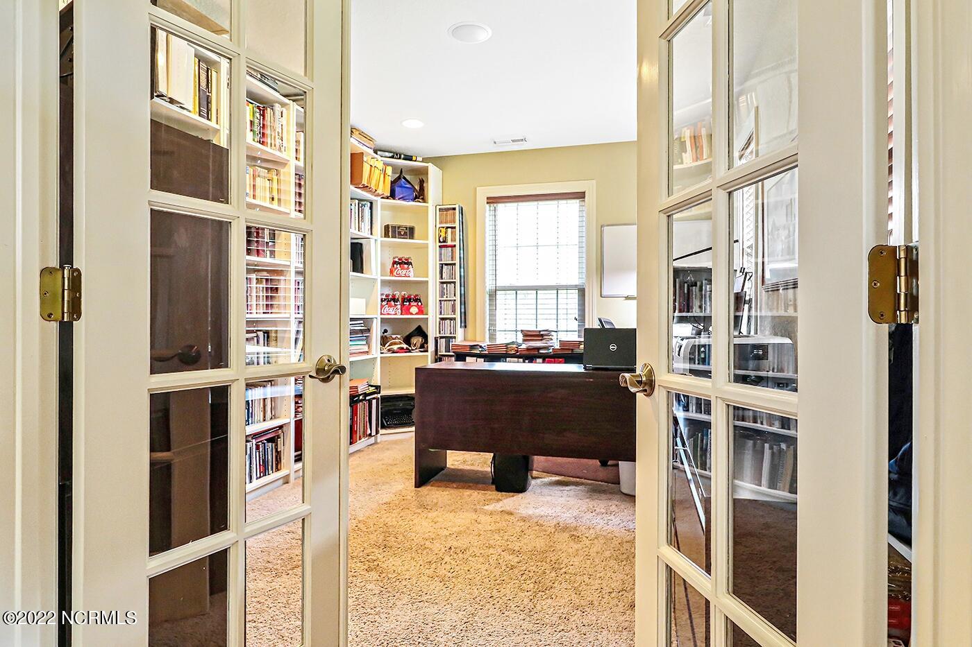 1079 Tulls Creek Road Moyock, NC 27958 - Photo 41 of 59 First Floor Office with built in shelving and carpeting.