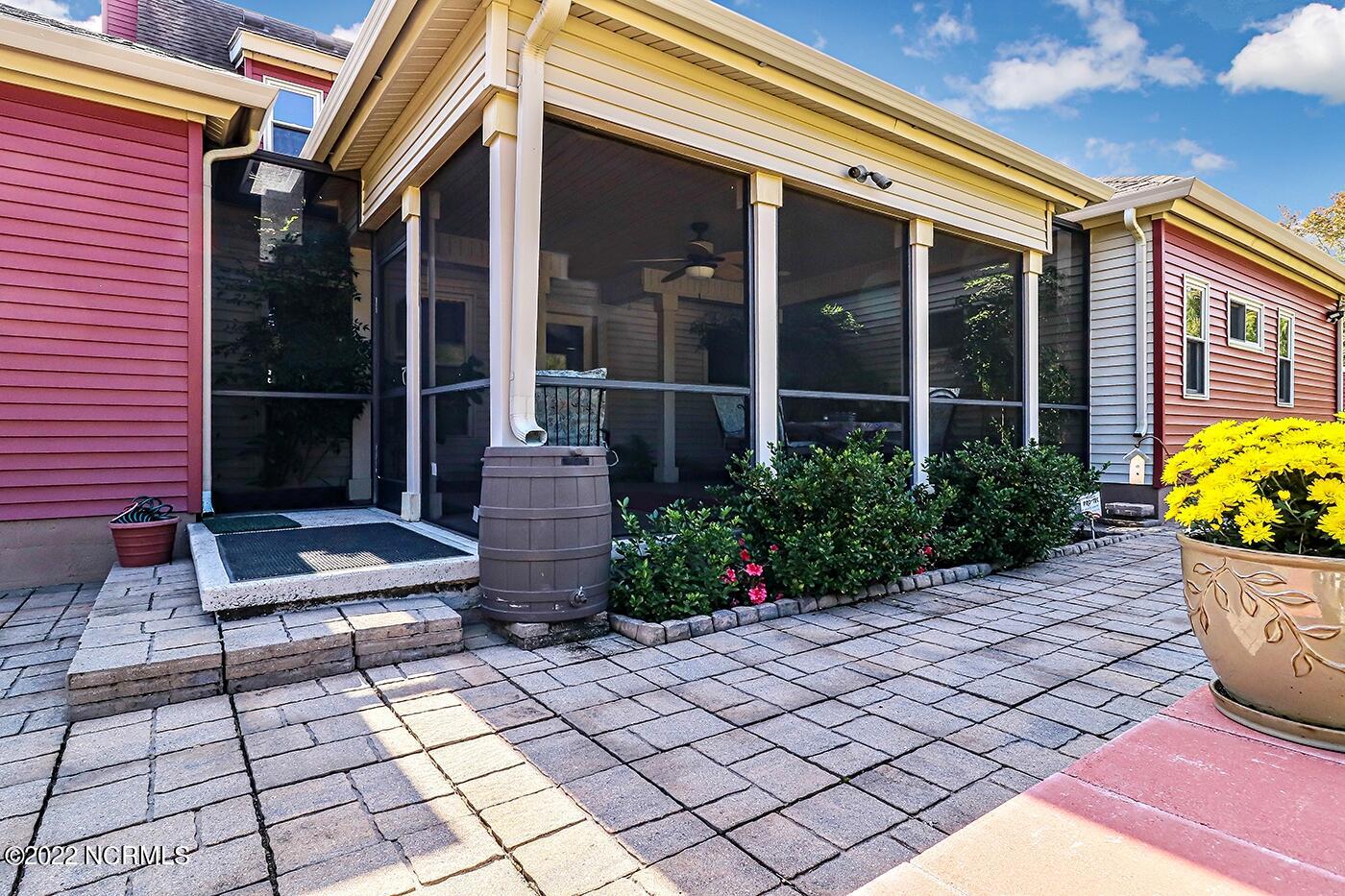 1079 Tulls Creek Road Moyock, NC 27958 - Photo 53 of 59 Screened Porch and Patio to enjoy the private and serene country setting.