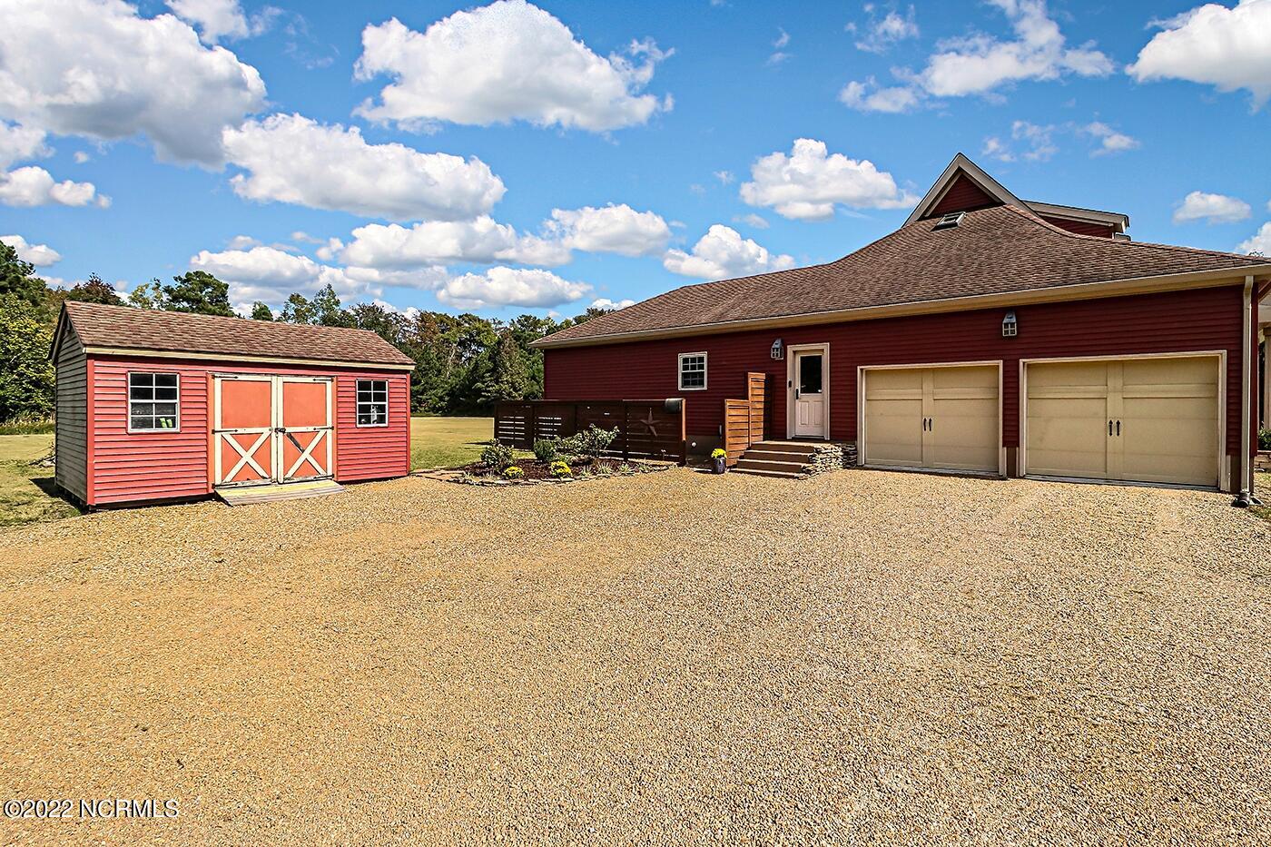 1079 Tulls Creek Road Moyock, NC 27958 - Photo 55 of 59 Two car attached garage and side entrance. Storage Shed will convey.