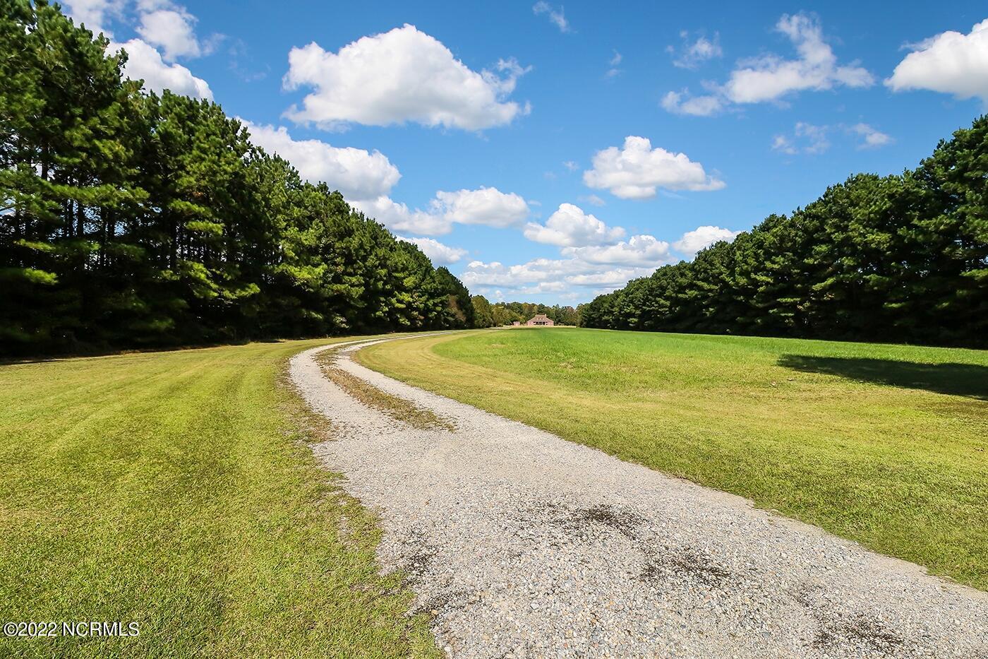 1079 Tulls Creek Road Moyock, NC 27958 - Photo 58 of 59 One of a kind, gracious southern style transitional 2 story home with its sprawling front porch and over 3100 sqft is nestled on 10 acres in Currituck County. Classic and exceptional details in this well maintained and lovingly cared for Home.