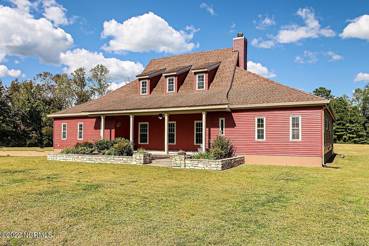 1079 Tulls Creek Road Moyock, NC 27958 - Photo 6 of 59 One of a kind, gracious southern style transitional 2 story home with its sprawling front porch and over 3100 sqft is nestled on 10 acres in Currituck County. Classic and exceptional details in this well maintained and lovingly cared for Home.
