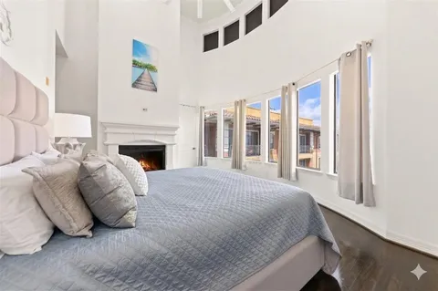 a bed room with a bed and a fireplace