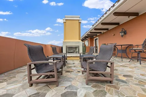 a patio with table and chairs
