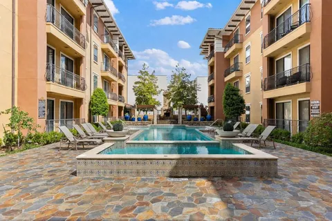 a view of a building with a yard