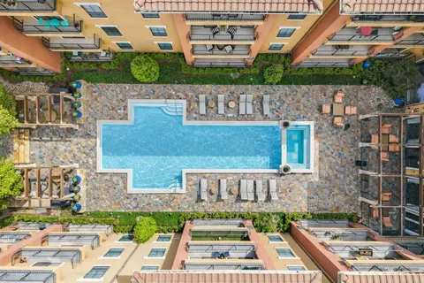 an aerial view of a house with a garden