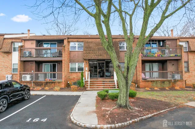 a front view of a building with garden