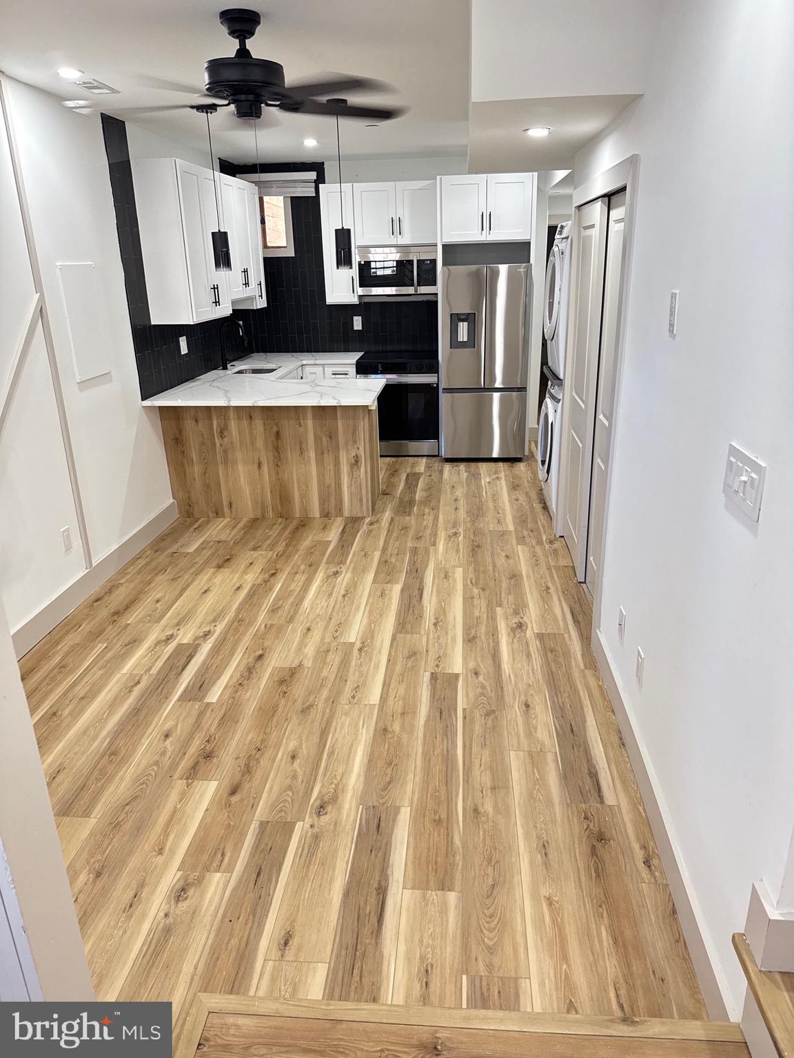 a view of a living room with a wooden floor