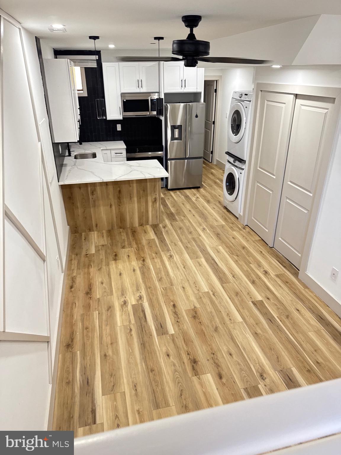 2031 North 19th Street, Unit A Philadelphia, PA 19121 - Photo 15 of 17 view of living room with furniture and a fireplace