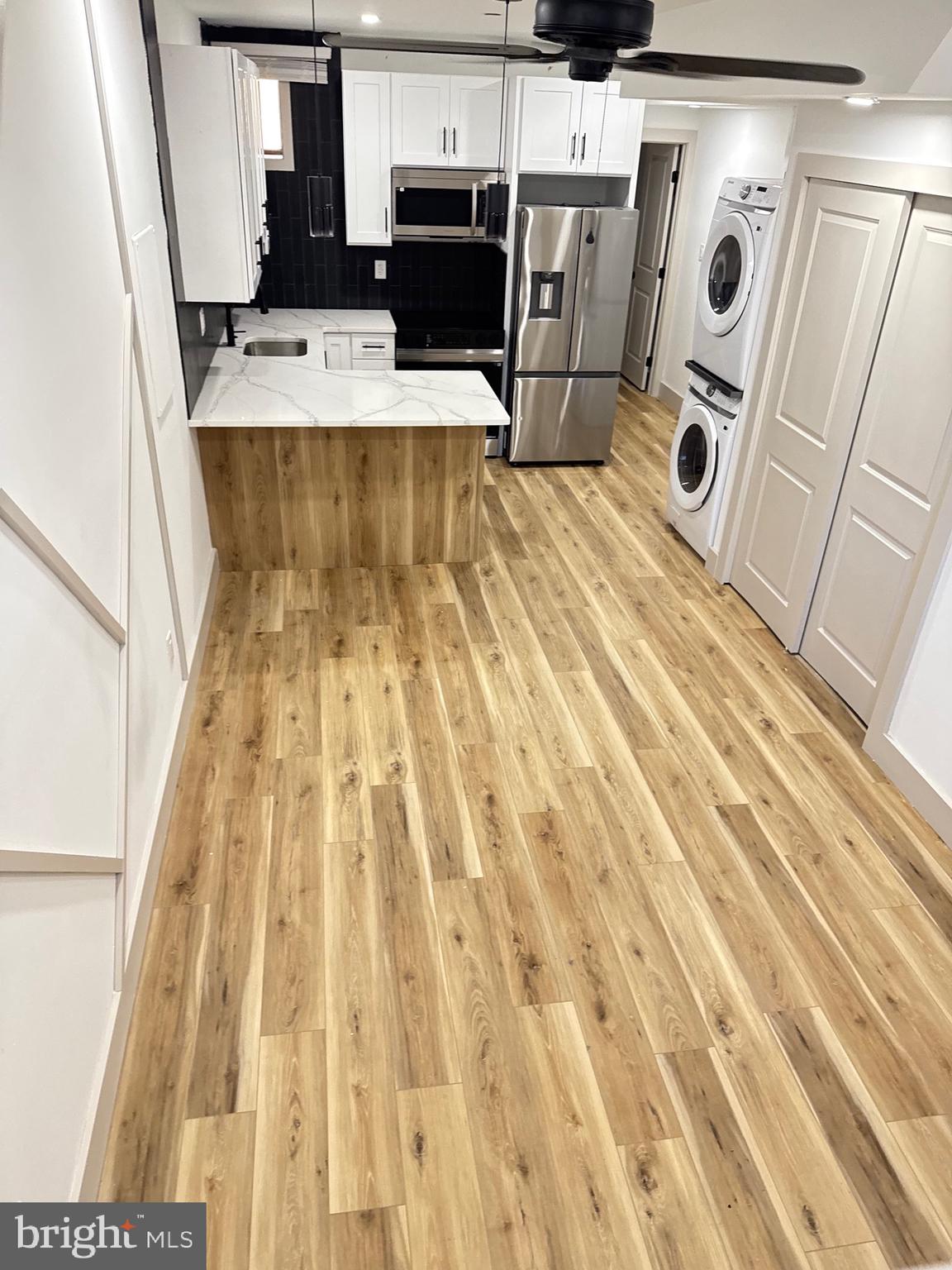 2031 North 19th Street, Unit A Philadelphia, PA 19121 - Photo 16 of 17 a view of kitchen and wooden floor