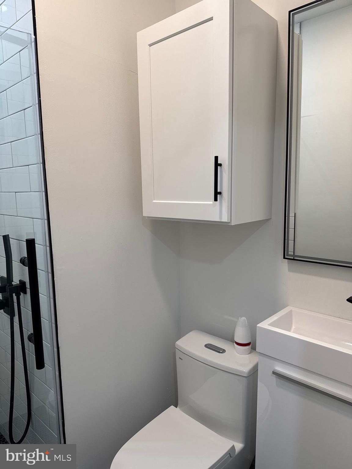 2031 North 19th Street, Unit A Philadelphia, PA 19121 - Photo 7 of 17 a bathroom with a toilet and a sink