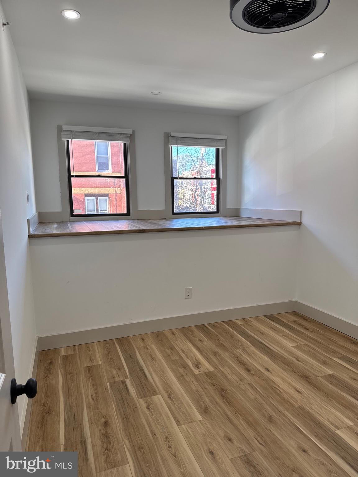 2031 North 19th Street, Unit A Philadelphia, PA 19121 - Photo 9 of 17 a view of wooden floor and windows in a room