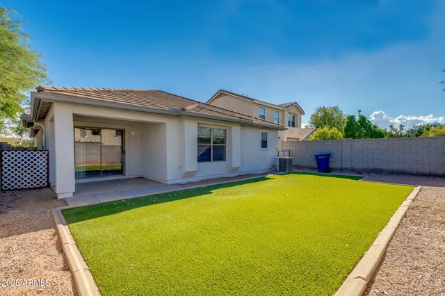 a view of swimming pool with table and chairs in wooden floor