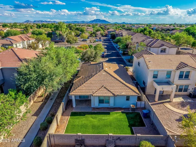 an aerial view of house with yard swimming pool and outdoor seating