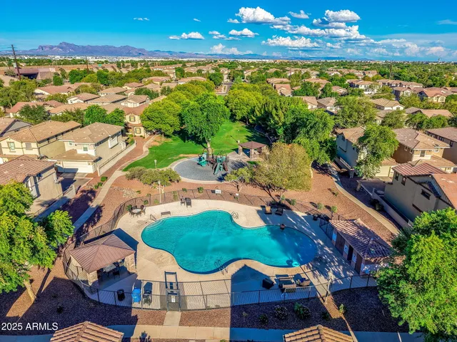 an aerial view of residential houses with outdoor space