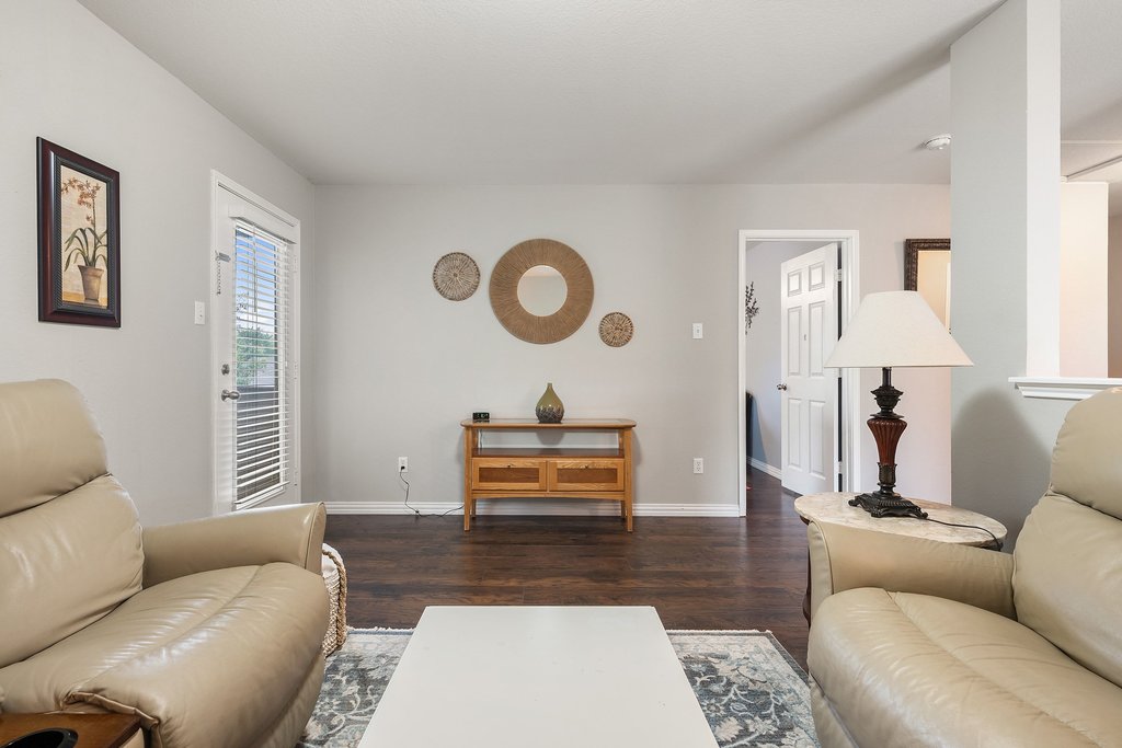 140 Wolfberry Path Buda, TX 78610 - Photo 21 of 35 a living room with furniture and a window