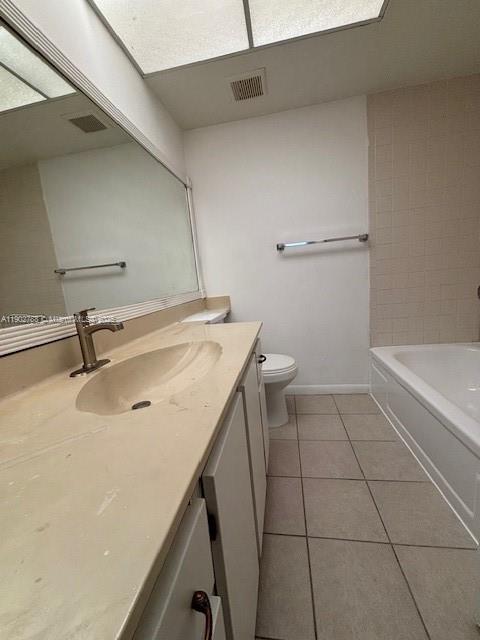 9235 Southwest 8th Street, Unit 510 Boca Raton, FL 33428 - Photo 11 of 23 a bathroom with a sink a toilet and a tub