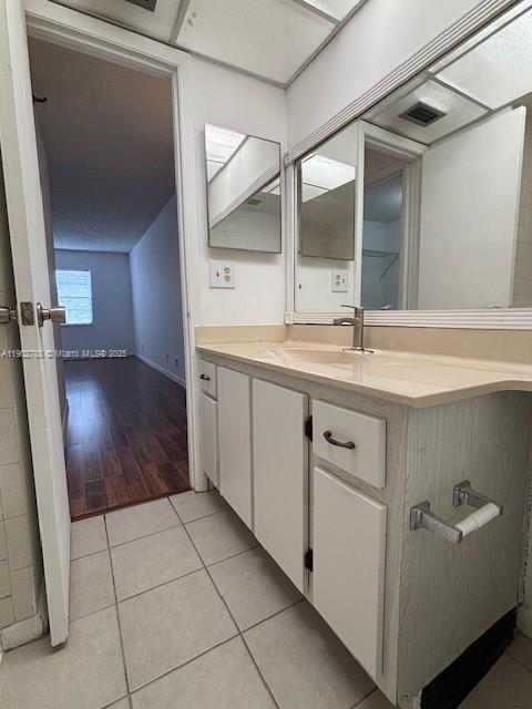 9235 Southwest 8th Street, Unit 510 Boca Raton, FL 33428 - Photo 13 of 23 a bathroom with a sink a mirror and a vanity