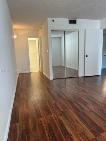 a view of wooden floor in an empty room