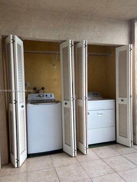 9235 Southwest 8th Street, Unit 510 Boca Raton, FL 33428 - Photo 19 of 23 a kitchen with a refrigerator and cabinets
