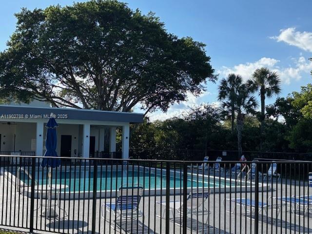 9235 Southwest 8th Street, Unit 510 Boca Raton, FL 33428 - Photo 22 of 23 a view of house with a backyard
