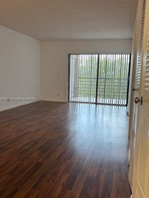 9235 Southwest 8th Street, Unit 510 Boca Raton, FL 33428 - Photo 6 of 23 a view of a room with wooden floor and a window