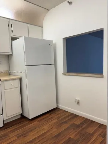 a bathroom with a toilet a sink and a mirror