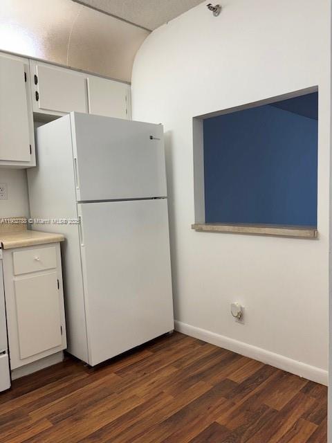 9235 Southwest 8th Street, Unit 510 Boca Raton, FL 33428 - Photo 9 of 23 a white refrigerator freezer sitting in a kitchen