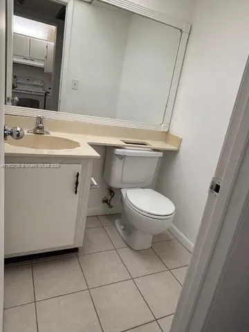 a bathroom with a sink a toilet and a tub