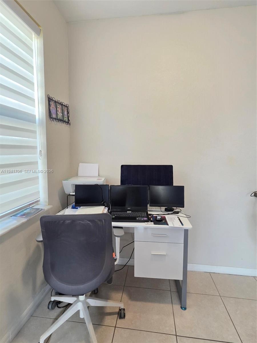 11702 Southwest 137th Place Miami, FL 33186 - Photo 15 of 30 a work room with furniture and a window