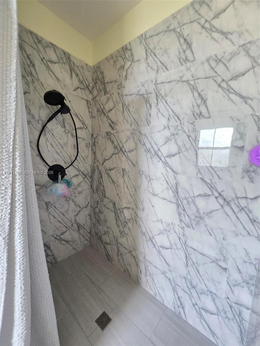 11702 Southwest 137th Place Miami, FL 33186 - Photo 21 of 30 a picture of door with wooden floor